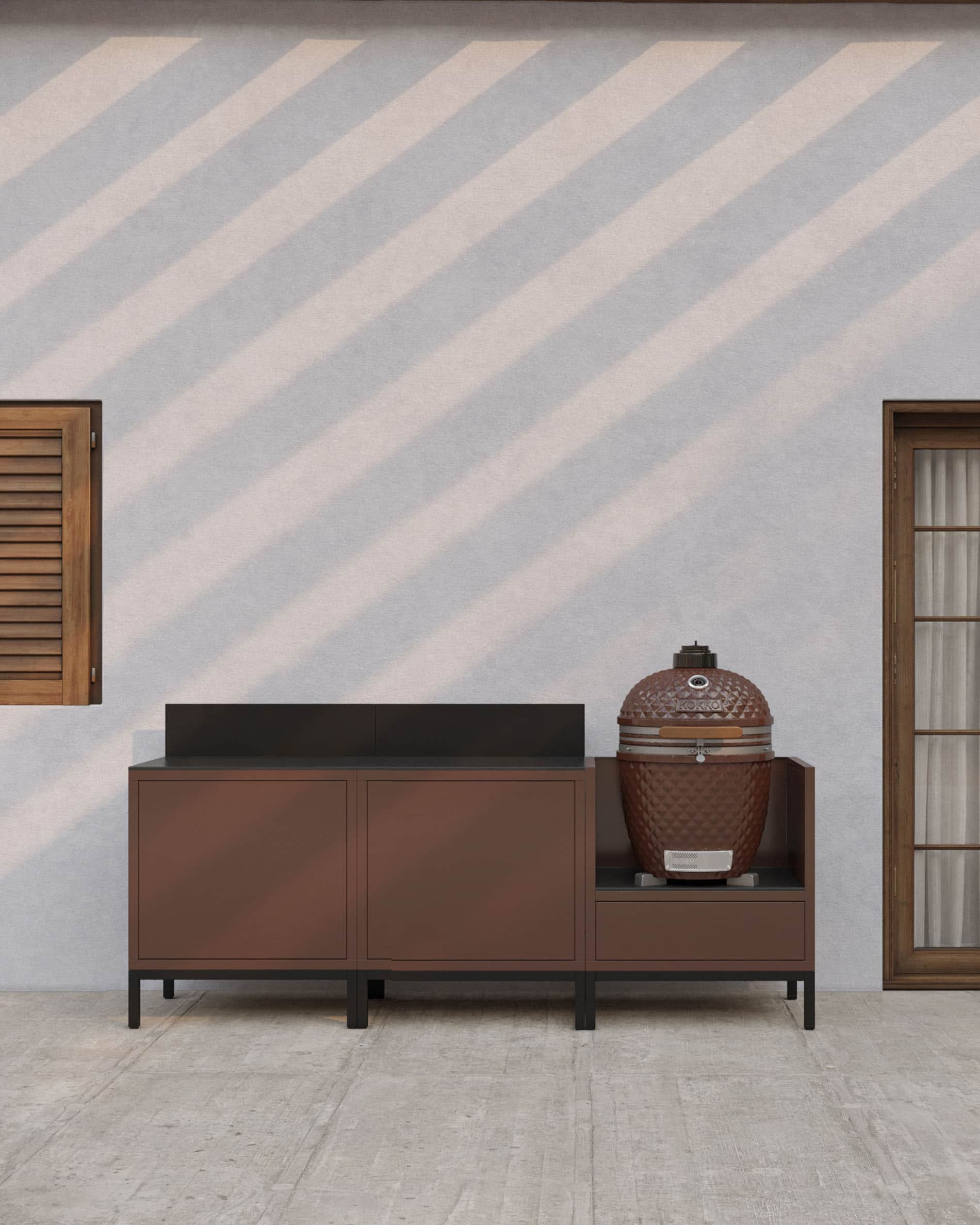 Lineaire buitenkeuken op palen in roestkleur met donker werkblad, gesloten opbergruimte en een module speciaal voor het integreren van een kamado.